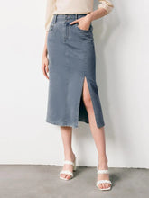 a woman in denim skirt